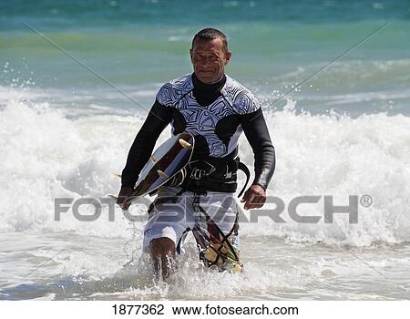 Tarifa, Cadiz, Andalusia, Spain; A Kitesurfer Coming Into The Shore From The Water On Punta Paloma Beach View Large Photo Image Stock Image - Tarifa, Cadiz, Andalusia, Spain; A Kitesurfer Coming Into The Shore From The Water On Punta Paloma Beach. Fotosearch