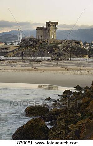 Stock Image - Tarifa, Cadiz, Andalusia, Spain; El Castillo Castle And Balneario Beach. Fotosearch