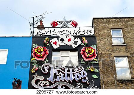 Stock Photo - Tatoo Shop In Camden High Street As Part Of The Famous Camden Market, North London, London, Uk. Fotosearch