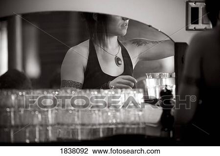 Tattooed Bartender Behind Counter Reflecting In Mirror View Large Photo Image Stock Image - Tattooed Bartender Behind Counter Reflecting In Mirror. Fotosearch