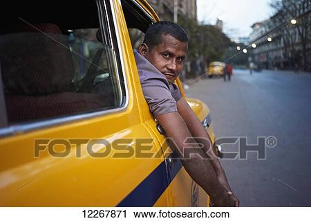 Stock Image - Taxi driver; Kolkata, West Bengal, India. Fotosearch