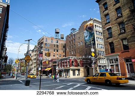 Stock Photo - Taxi Driving Through A Street Between Tribeca And Soho, Manhattan, New York, Usa. Fotosearch