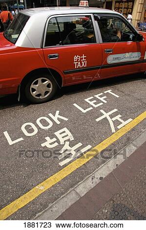 Stock Image - Taxi For Hire In Street Of Kowloon. Fotosearch