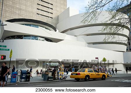 Stock Photography - Taxi In Front Of The Guggenheim Museum, Museum Mile, Manhattan, New York, Usa. Fotosearch