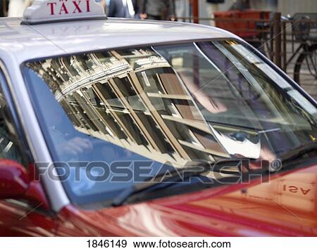 Taxi With Reflection Of Building; Hong Kong, China View Large Photo Image Stock Photo - Taxi With Reflection Of Building; Hong Kong, China. Fotosearch