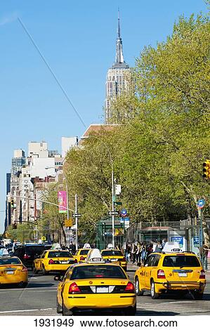 Stock Photo - Taxis And Views Of The Empire State Building From The West Village, Manhattan, New York, Usa. Fotosearch