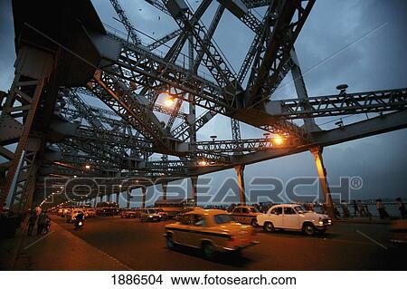 Taxis Going Over Howra Bridge In Calcutta At Dusk View Large Photo Image Picture - Taxis Going Over Howra Bridge In Calcutta At Dusk. Fotosearch