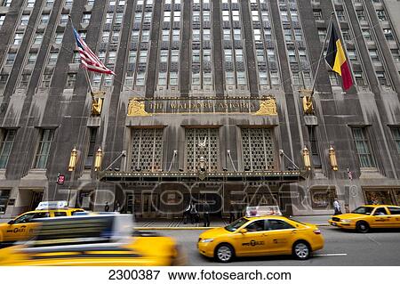 Stock Photo - Taxis Passing By The Waldorf Astoria Hotel In Midtown Manhattan, New York, Usa. Fotosearch