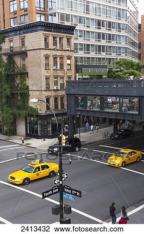 Taxi's passing under the High Line urban park, Manhattan; New York City, New York, United States of America View Large Photo Image Stock Image - Taxi's passing under the High Line urban park, Manhattan; New York City, New York, United States of America. Fotosearch