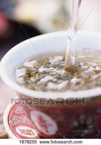 Tea Being Poured Into Tea Cup, Close Up View Large Photo Image Stock Photography - Tea Being Poured Into Tea Cup, Close Up. Fotosearch