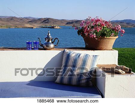 Stock Photo - Tea Pot And Glasses With Mint Tea On A Benched Wall. Fotosearch