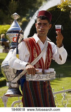 Stock Photo - Tea Vendor In Front Of The Blue Mosque; Istanbul, Turkey. Fotosearch