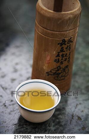 Stock Image - Teacup and tea Makong tea plantation Taipei Taiwan. Fotosearch
