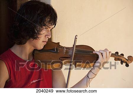 Teenage Boys Playing A Violin And A Guitar At The Jesuit Mission Of Santa Ana De Velasco, Santa Cruz Department, Bolivia View Large Photo Image Stock Photo - Teenage Boys Playing A Violin And A Guitar At The Jesuit Mission Of Santa Ana De Velasco, Santa Cruz Department, Bolivia. Fotosearch