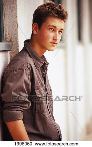Teenage Caucasian Boy Leaning Back Against The Wall (Side Angle View) View Large Photo Image Stock Image - Teenage Caucasian Boy Leaning Back Against The Wall (Side Angle View). Fotosearch
