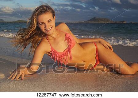 Stock Photo - Teenage girl at the beach; Kailua, Island of Hawaii, Hawaii, United States of America. Fotosearch