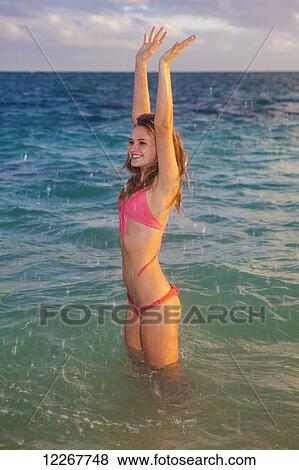 Stock Photo - Teenage girl at the beach; Kailua, Island of Hawaii, Hawaii, United States of America. Fotosearch