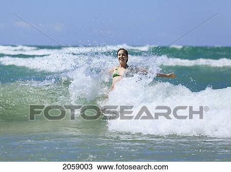 Teenage Girl Playing In The Waves, Sandbanks Provincial Park, Ontario, Canada View Large Photo Image Stock Image - Teenage Girl Playing In The Waves, Sandbanks Provincial Park, Ontario, Canada. Fotosearch