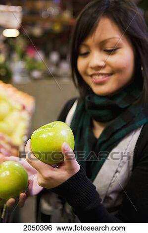 Teenage Girl Shopping For Apples View Large Photo Image Stock Photograph - Teenage Girl Shopping For Apples. Fotosearch
