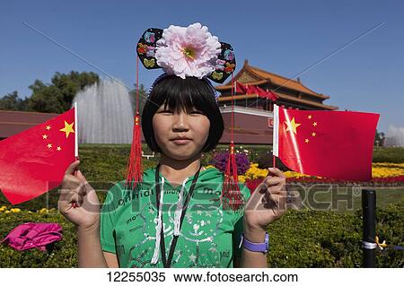 Teenage girl waving flags in Tianamen Square on National Day; Beijing, China View Large Photo Image Stock Photography - Teenage girl waving flags in Tianamen Square on National Day; Beijing, China. Fotosearch