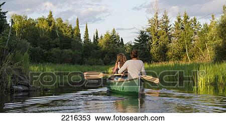 Teenage Girls Paddling A Canoe In A Lake; Lake Of The Woods Ontario Canada View Large Photo Image Stock Image - Teenage Girls Paddling A Canoe In A Lake; Lake Of The Woods Ontario Canada. Fotosearch