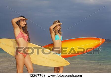 Teenage sisters with their surfboards; Kailua, Island of Hawaii, Hawaii, United States of America View Large Photo Image Stock Photo - Teenage sisters with their surfboards; Kailua, Island of Hawaii, Hawaii, United States of America. Fotosearch