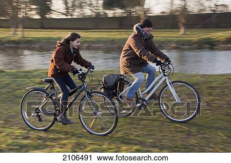 Teenager cycling with grandfather; United Kingdom View Large Photo Image Stock Image - Teenager cycling with grandfather; United Kingdom. Fotosearch
