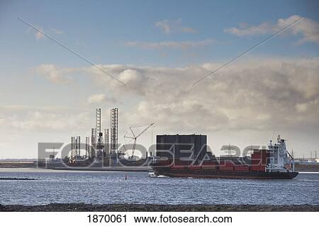 Teesside, England; A Barge In The Water And Refinery Along The Shore View Large Photo Image Stock Image - Teesside, England; A Barge In The Water And Refinery Along The Shore. Fotosearch