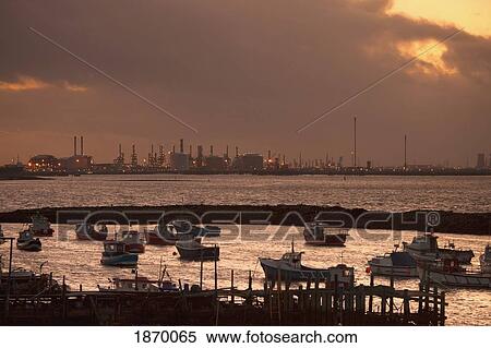 Teesside, England; Boats In The Harbor And A Refinery Along The Shore View Large Photo Image Stock Photography - Teesside, England; Boats In The Harbor And A Refinery Along The Shore. Fotosearch