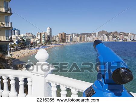 Stock Photography - Telescope At A Railing With A Viewpoint To Leavante Beach; Benidorm Alicante Province Costa Blanca Spain. Fotosearch