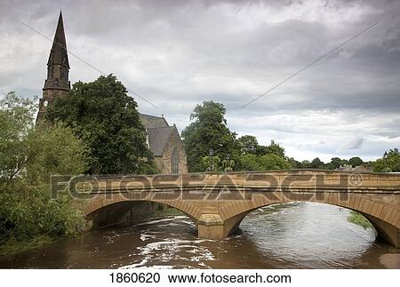 Stock Image - Telford Bridge Over River Wansbeck; Morpeth, Northumberland, England. Fotosearch