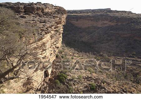 Tellem houses set in the Bandiagara Escarpment, Irelli, Mali View Large Photo Image Stock Photo - Tellem houses set in the Bandiagara Escarpment, Irelli, Mali. Fotosearch