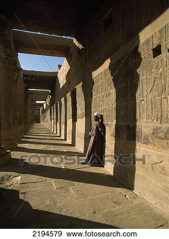 Stock Photo - Temple guard in the West Colonnade covered in reliefs and hieroglyphs, Temple of Isis, Philae Island near Aswan, Egypt.. Fotosearch