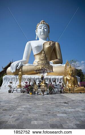 Stock Image - Temple Statues, Wat Phra That Doi Kham; Chiang Mai, Thailand. Fotosearch