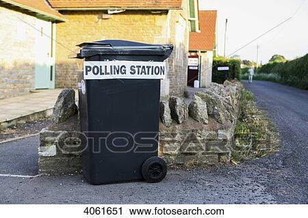 Temporary polling station for South Somerset District Council Parish elections at St Margaret's, Horsington Village Hall with sign placed on wheelie bin; Horsington, South Somerset, England View Large Photo Image Stock Image - Temporary polling station for South Somerset District Council Parish elections at St Margaret's, Horsington Village Hall with sign placed on wheelie bin; Horsington, South Somerset, England. Fotosearch