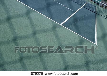 Stock Photography - Tennis Courts As Seen Through Chain Link Fence. Fotosearch