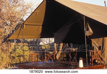 Stock Image - Tent With Deck And Chairs. Fotosearch