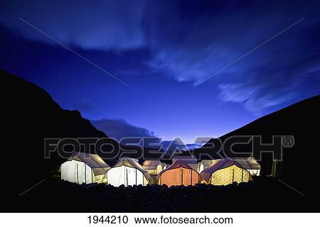 Stock Image - Tents Illuminated In A Valley At Night; Tso Moriri Ladakh India. Fotosearch