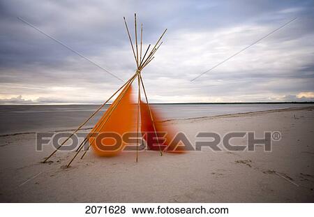 Stock Photo - Tepee Cover Blowing In Wind, Grand Beach, Manitoba. Fotosearch