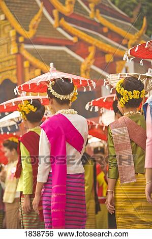 Thai Women In Traditional Dresses In New Year Festival, Rear View; Chiang Mai, Thailand View Large Photo Image Stock Photograph - Thai Women In Traditional Dresses In New Year Festival, Rear View; Chiang Mai, Thailand. Fotosearch