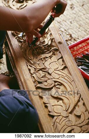 Stock Image - Thailand, Arts And Crafts Teak Carving Deomonstration. Fotosearch