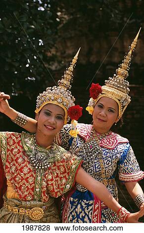 Thailand, Ayuthaya, Portrait Of Two Smiling Thai Lakhon Women Dancers Among Ruins Of Wat Chai Wattanaram View Large Photo Image Stock Photo - Thailand, Ayuthaya, Portrait Of Two Smiling Thai Lakhon Women Dancers Among Ruins Of Wat Chai Wattanaram. Fotosearch