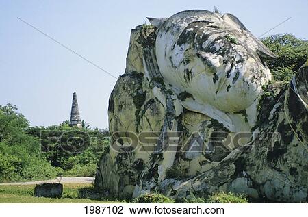 Thailand, Ayuttahaya, Closeup Reclining Buddha, Greenery In Background. View Large Photo Image Stock Image - Thailand, Ayuttahaya, Closeup Reclining Buddha, Greenery In Background.. Fotosearch