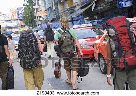 Stock Image - Thailand, Backpackers On Khao San Road; Bangkok. Fotosearch