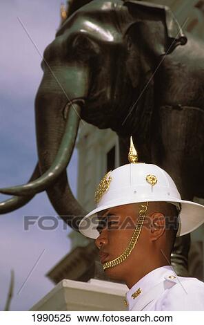 Stock Photography - Thailand, Bangkok, A Very Serious Guard And Elephant At The Royal Palace. Fotosearch