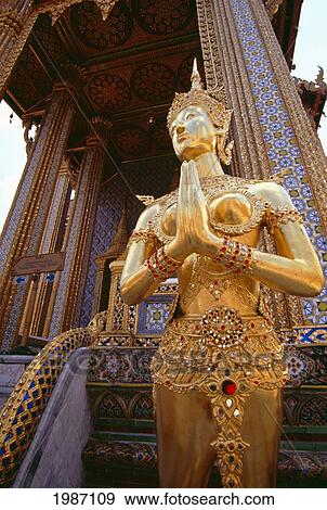 Thailand, Bangkok, Golden statue Apsonsi (half woman half lion); Wat Phra Keo View Large Photo Image Stock Photo - Thailand, Bangkok, Golden statue Apsonsi (half woman half lion); Wat Phra Keo. Fotosearch