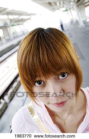 Thailand, Bangkok, Thai Teenager At Train Station. View Large Photo Image Stock Image - Thailand, Bangkok, Thai Teenager At Train Station.. Fotosearch