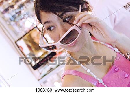 Stock Image - Thailand, Bangkok, Thai Teenager Shopping.. Fotosearch