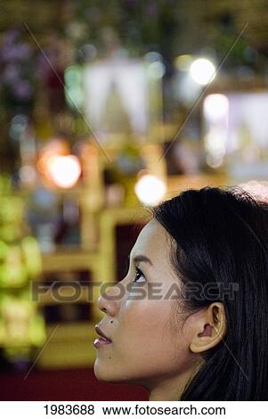 Thailand, Bangkok, Thai Woman At A Temple. View Large Photo Image Stock Photo - Thailand, Bangkok, Thai Woman At A Temple.. Fotosearch
