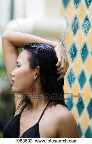 Thailand, Bangkok, Thai Woman In Outdoor Shower. View Large Photo Image Stock Image - Thailand, Bangkok, Thai Woman In Outdoor Shower.. Fotosearch